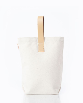 Leather-Grip Wine Carrier for Two Bottles featuring durable natural canvas, genuine leather handle, and divided compartments for securely carrying two wine bottles.