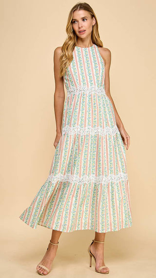 Woman wearing a patterned dress on a beige background