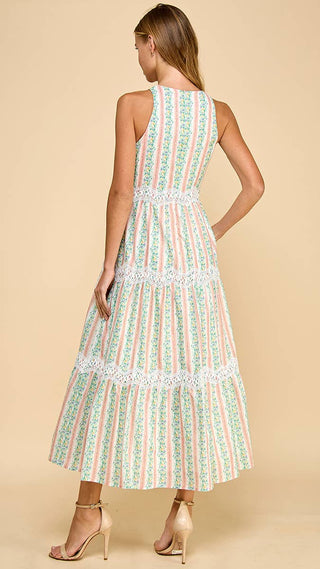 Woman wearing a patterned dress on a beige background
