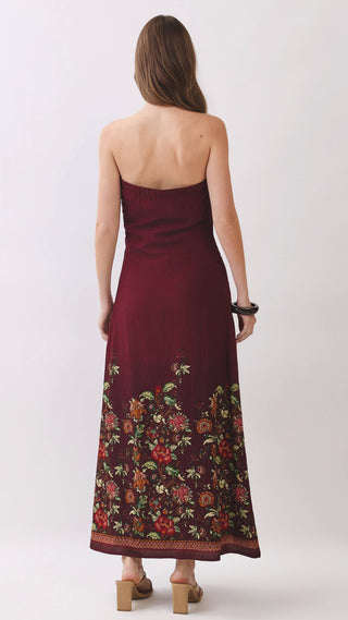 Burgundy strapless maxi dress with floral design on the bottom