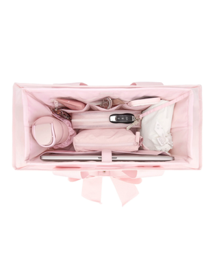 Ballet pink tote bag organizer insert with multiple interior pockets holding a water bottle, phone, sunglasses, cosmetics, and everyday essentials.