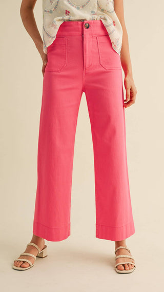 Woman wearing bright pink wide leg trouser pants high waisted