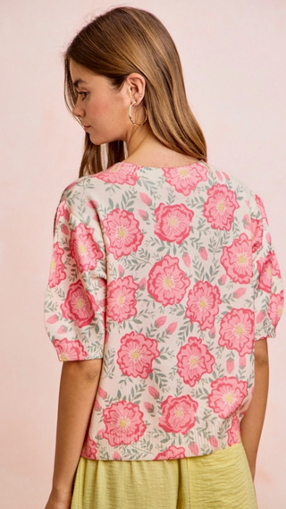 Floral short sleeve sweater with pink flowers on a light pink background