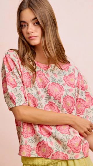 Floral Short Sleeve sweater with pink flowers on a light pink background