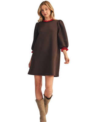 Women’s chocolate brown quilted shift dress with 3/4 puff sleeves and red ruffle trim at the neckline and cuffs.