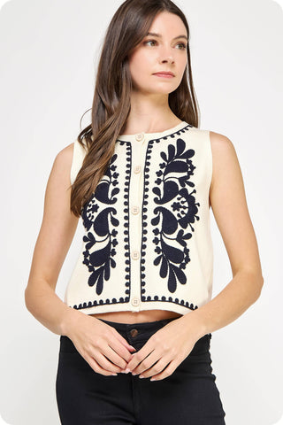 Sleeveless ivory button up knit vest top with black embroidered design