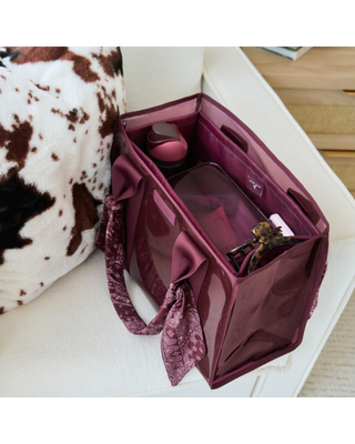 Mulberry tote bag organizer insert with multiple interior pockets holding a water bottle, phone, sunglasses, cosmetics, and everyday essentials.