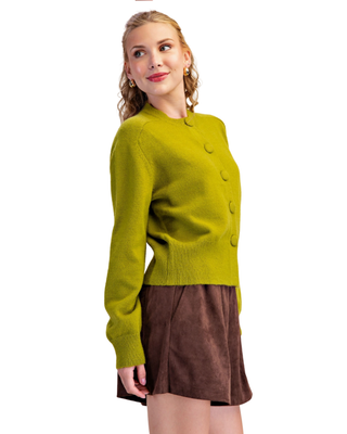 Women's chartreuse green knit cardigan with fabric-covered buttons, crew neckline, long sleeves and ribbed trim.