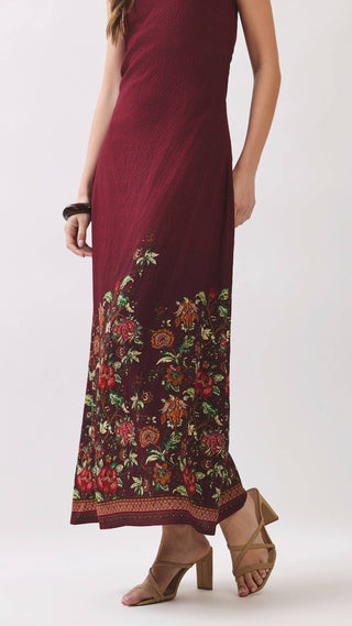 Burgundy strapless maxi dress with floral design on the bottom