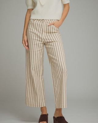 Women's cream straight-leg pants with mocha brown pinstripes, high-rise waist, cropped ankle-length fit, and functional front pockets.