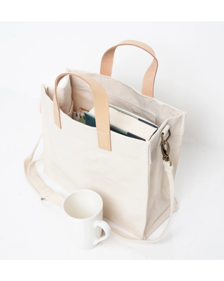 Mini Advantage Bag featuring natural heavyweight canvas, genuine leather handles, detachable shoulder strap, and spacious organized interior.