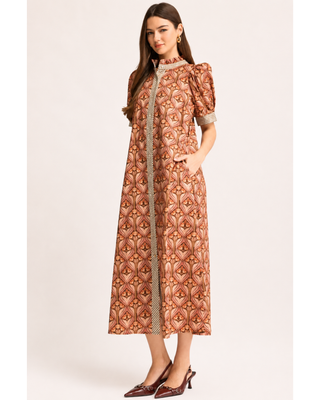 Rust and blush floral print midi dress with puff sleeves, ruffled neckline, gingham trim, button-front detail and side pockets.