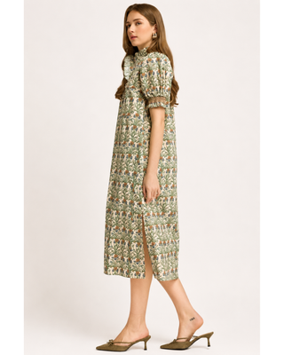 Cream botanical floral midi dress with green, blue and rust print, ruffled neckline, puff sleeves and side pockets.
