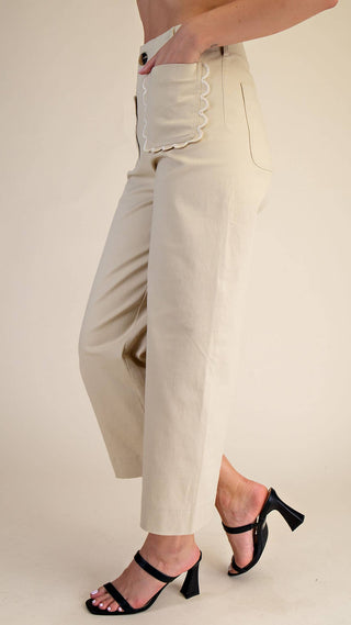 Beige high waisted pants with front scallop pocket design