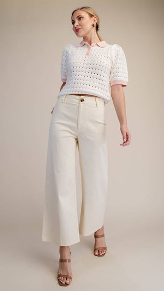 Woman wearing creme wide leg high waisted pants