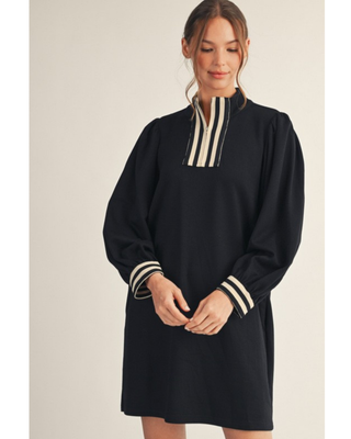 Women’s burgundy long sleeve mini dress with cream striped quarter-zip neckline, striped cuffs, puff sleeves and relaxed shift fit.