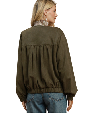 Women’s olive green puff sleeve jacket with gathered front detailing, long sleeves, elasticized cuffs and hem, and relaxed fit.