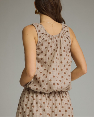 Women's sleeveless mocha polka dot bubble hem blouse with a round neckline and relaxed fit in a lightweight woven fabric.