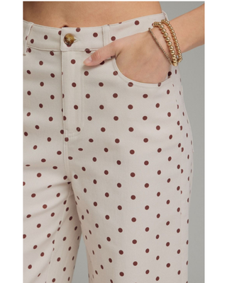 Women's ivory wide-leg pants with a mocha brown polka dot print, high-rise waist, and relaxed silhouette, styled for a chic boutique outfit.