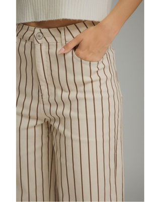 Women's cream straight-leg pants with mocha brown pinstripes, high-rise waist, cropped ankle-length fit, and functional front pockets.