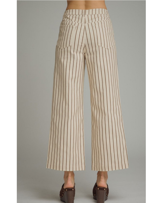 Women's cream straight-leg pants with mocha brown pinstripes, high-rise waist, cropped ankle-length fit, and functional front pockets.