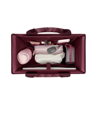 Mulberry tote bag organizer insert with multiple interior pockets holding a water bottle, phone, sunglasses, cosmetics, and everyday essentials.