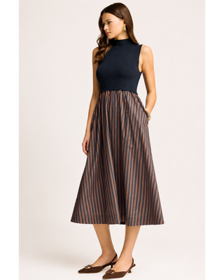 Navy sleeveless mock-neck mixed-media midi dress with a gathered brown and navy striped skirt and side pockets.