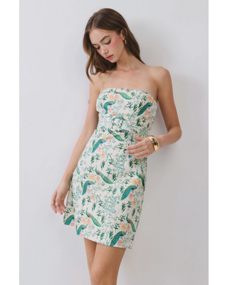 Women’s ivory strapless mini dress with green peacock and botanical floral print and fitted A-line silhouette.