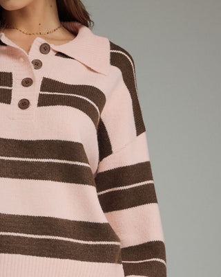 Women's blush pink and mocha brown striped knit sweater featuring a collared button neckline, relaxed fit, and rugby-inspired design.