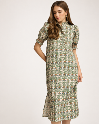 Cream botanical floral midi dress with green, blue and rust print, ruffled neckline, puff sleeves and side pockets.