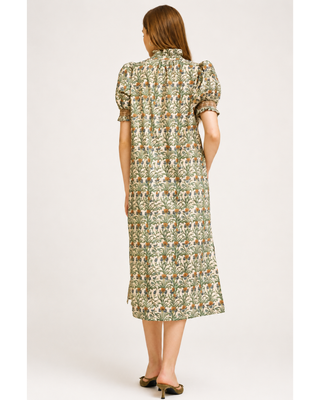 Cream botanical floral midi dress with green, blue and rust print, ruffled neckline, puff sleeves and side pockets.