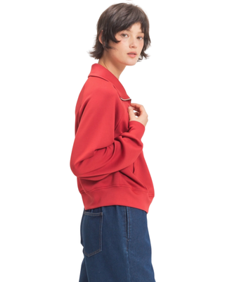 Women’s red half-zip pullover with fold-over collar, long sleeves, kangaroo front pocket and relaxed fit.