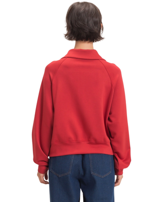 Women’s red half-zip pullover with fold-over collar, long sleeves, kangaroo front pocket and relaxed fit.