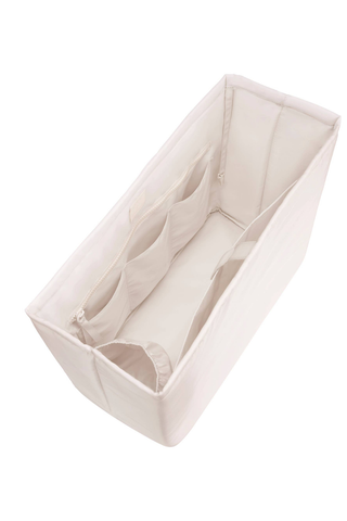 Angled view of the empty Case-Mate French Vanilla Jelly Tote Organizer showing its structured compartments.