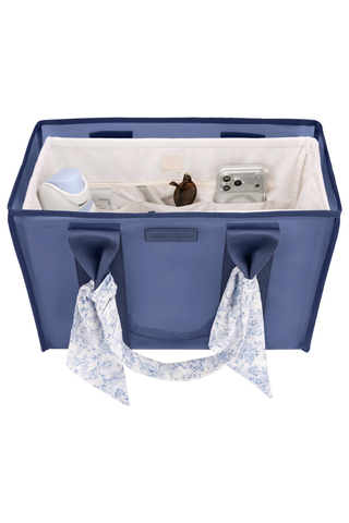 Front view of the Case-Mate French Vanilla Jelly Tote Organizer inside a navy bow tote.