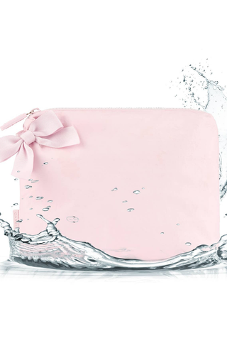 Case-Mate Ballet Pink Bow Crinkle Makeup Bag shown with water splashing around its waterproof exterior.