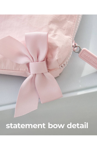 Close-up of the statement bow detail on the Case-Mate Ballet Pink Bow Crinkle Makeup Bag.