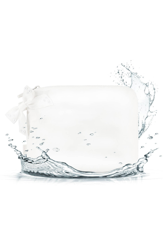 Case-Mate Ivory Pearl Bow Crinkle Makeup Bag shown with water splashing around its waterproof exterior.