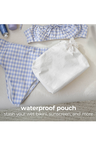 Case-Mate Ivory Pearl Bow Crinkle Makeup Bag inside a gingham tote, highlighting its waterproof material.