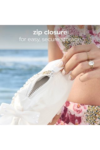 Close-up of the secure zipper closure on the Case-Mate Ivory Pearl Bow Crinkle Makeup Bag.