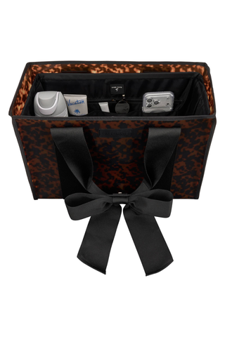 Case-Mate Midnight Black Jelly Tote Organizer inside a tortoiseshell tote, showing its compartments and bow detail.