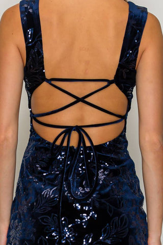 Navy velvet mini dress with shimmering vine sequin detail, square neckline, wide straps and fitted silhouette.