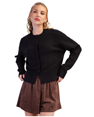 Women’s black knit cardigan with crew neckline, tonal front buttons, long sleeves, ribbed trim and relaxed fit.