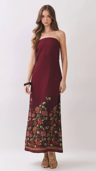 Burgundy strapless maxi dress with floral design on the bottom