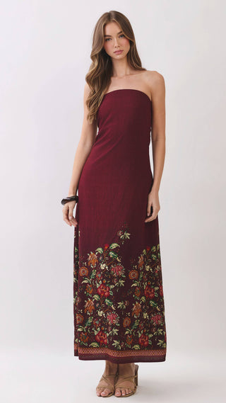 Burgundy strapless maxi dress with floral design on the bottom