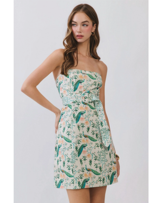 Women’s ivory strapless mini dress with green peacock and botanical floral print and fitted A-line silhouette.