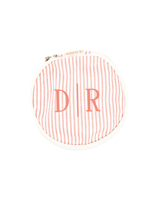 Stripes Circle Case in Rose Tan featuring a classic striped canvas design, structured round shape, and zip-around closure.