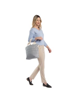 Stripes Cooler Tote in navy stripe featuring an insulated interior, front slip pocket, shoulder straps, removable crossbody strap, and spacious cooler compartment.