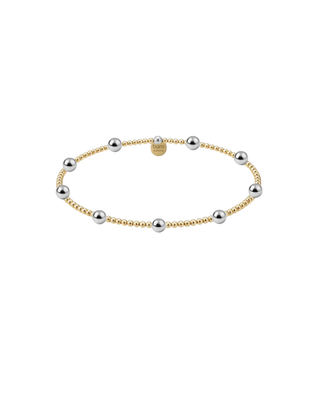 Two-tone beaded bracelet with small gold beads and evenly spaced polished silver beads for women.