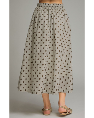 Women's mocha polka dot A-line midi skirt with a high-rise waistband and flowy silhouette in a lightweight woven fabric, styled for an elegant boutique look.